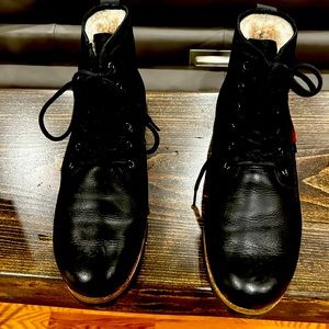 Beautiful pair black shearling boots .